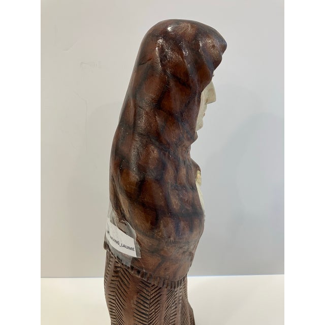 This hand carved and painted sculpture was created by Alfonsas Skiesgilas ( 1919-2009) It is signed in pencil on the...