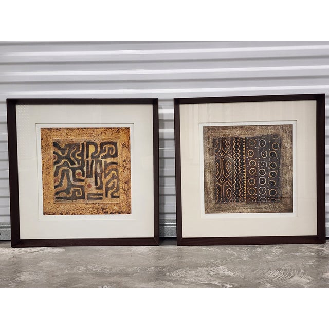 Ethan Allen African mud cloth textile wall art lithography by Joseph. The art work is framed in a dark mahagony wood...