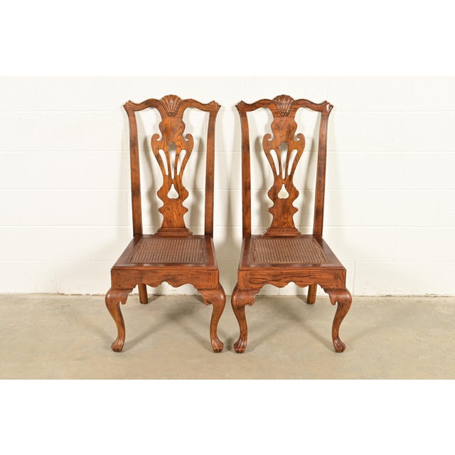 An outstanding pair of Chippendale or Georgian style side chairs or dining chairs By Henredon USA, Circa 1980s Carved...