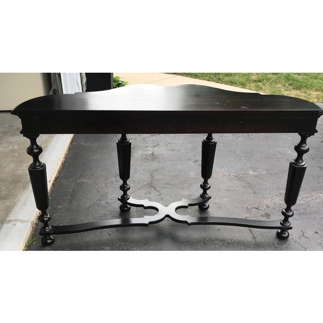 Henredon scalloped console table with french stled stretcher. This is from the Cindy Colection with an umber toned finish....