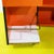 2000 - 2009 Orange Laminated Sewing Machine Cube on Wheels For Sale - Image 5 of 11