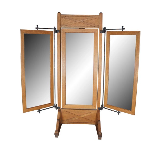 A very large and impressive antique triple cheval tailor / Haberdashers dressing mirror. Made of quartersawn oak featuring...