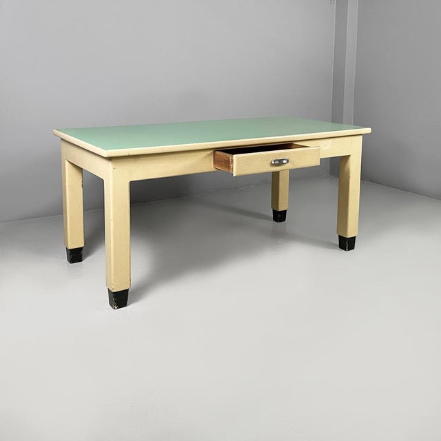 Italian mid-century modern dining table in white and aqua green wood, 1940s Dining table with a rectangular top in aqua...