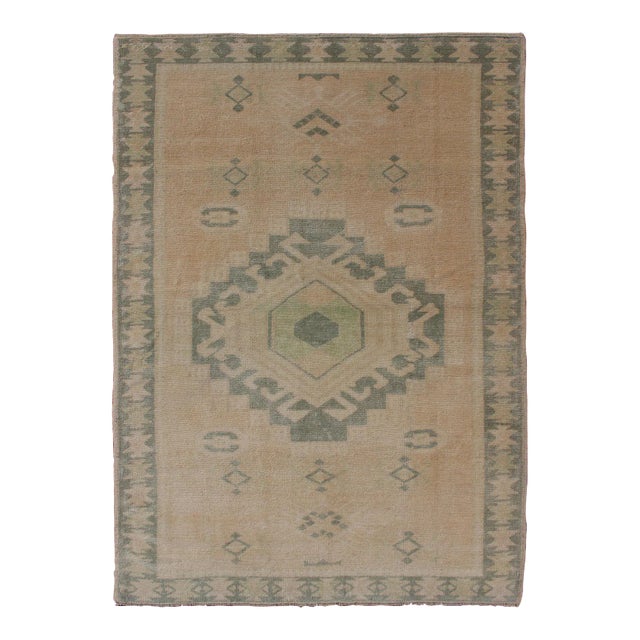 Vintage Hand Knotted Oushak Rug With Central Medallion Warm Tones With Green Tones For Sale