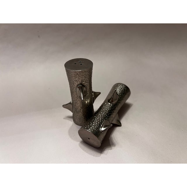 A striking salt and pepper shaker set from the Michael Aram Thorn Collection, featuring the designer's signature...
