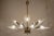 Italian chandelier of the 1950s of the 20th century, made of polished brass and black lacquered aluminum, with sandblasted...