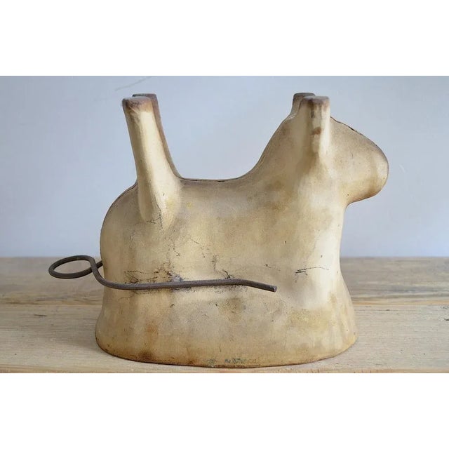 Very rare baking pan from terracotta in the shape of an Easter lamb / sheep. The baking pan comes from approx. 1880 and is...