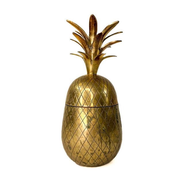 A vintage brass decorative pineapple jar with top and base. This is the perfect accessory to add to your mid century or...