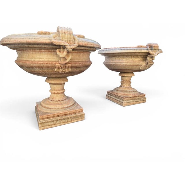 Impressive pair of monumental kraters carved from richly figured onyx, dating from the 1950s and retaining their original...