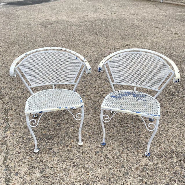 Vintage Wrought Iron Woodard Salterini Style Mid Century Outdoor Patio Chairs - Pair. Circa Mid to Late 20th Century....