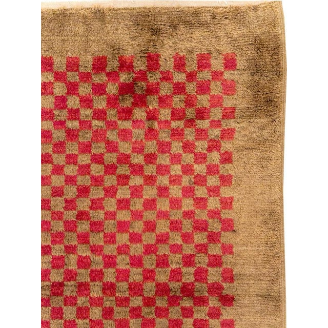 This Mid-20th century Turkish Anatolian Art Deco Style small room-size carpet presents a striking minimalist composition...