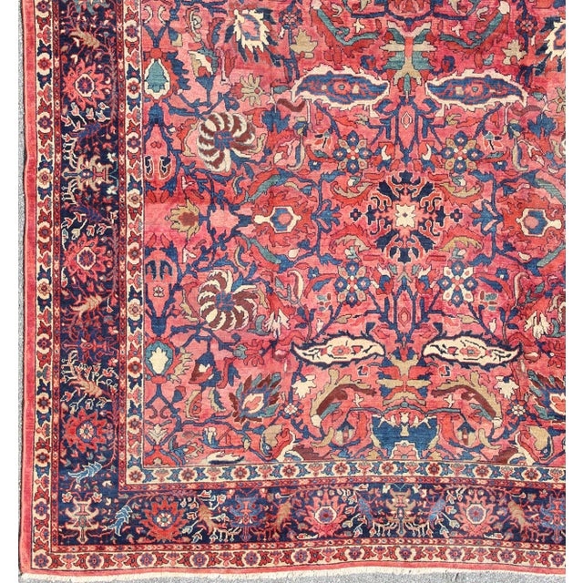 Antique Persian Sultanabad rug with Large Palmettes and flowers in rose red. Pinkish red and Blue. 11-20207, 10'8 x 14'8...