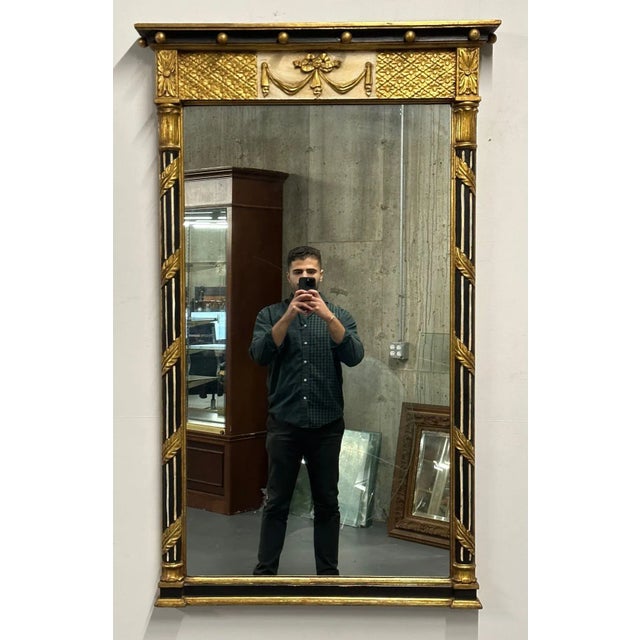 Hollywood Regency Wall or Console Mirror, Giltwood, Made in Italy A fine rectangular mirror having ebony and gilt design....