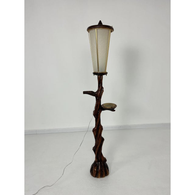 Floor lamp, 1950s Complete and in good condition. Wood, parchment and brass. E 27 lamp European Plug (up to 250V).The...