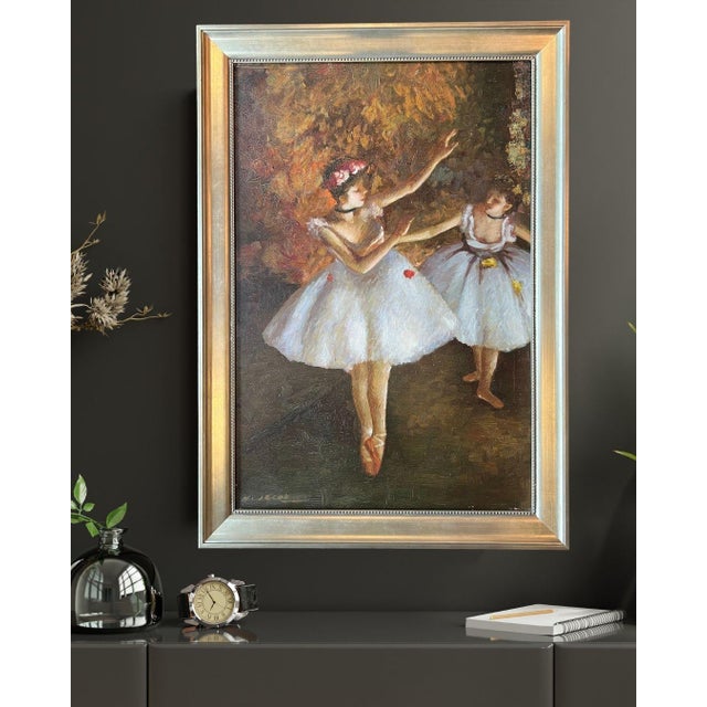 Titled, "Autumn Rehearsal," this graceful oil painting depicts two young ballet dancers in white tutus with a richly...