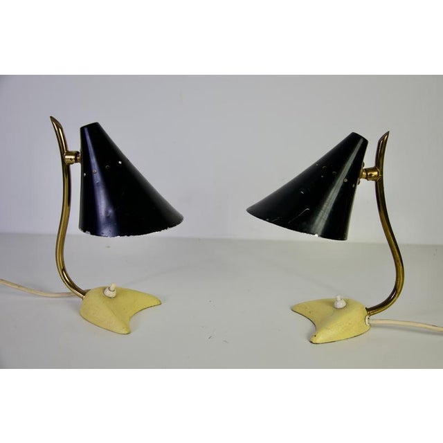 Pair of mid-century modern italian brass table lamps, 1960s. This expressive vintage pair combines curved brass stems with...