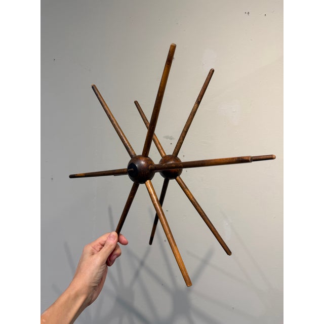 This is a vintage (or older) wooden yarn winder, also known as a swift. These devices were essential tools for spinners...