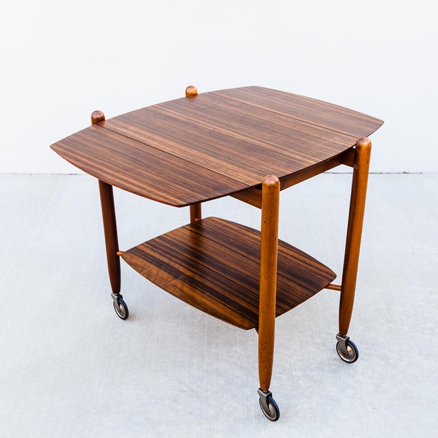 Restored Scandinavian-style bar cart or serving trolley by Vanson, made in the United Kingdom in the 1950s. The two-tiered...