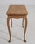 A 20th century French side table crafted in oak and designed in the Louis XV style, defined by its curved legs and shaped...