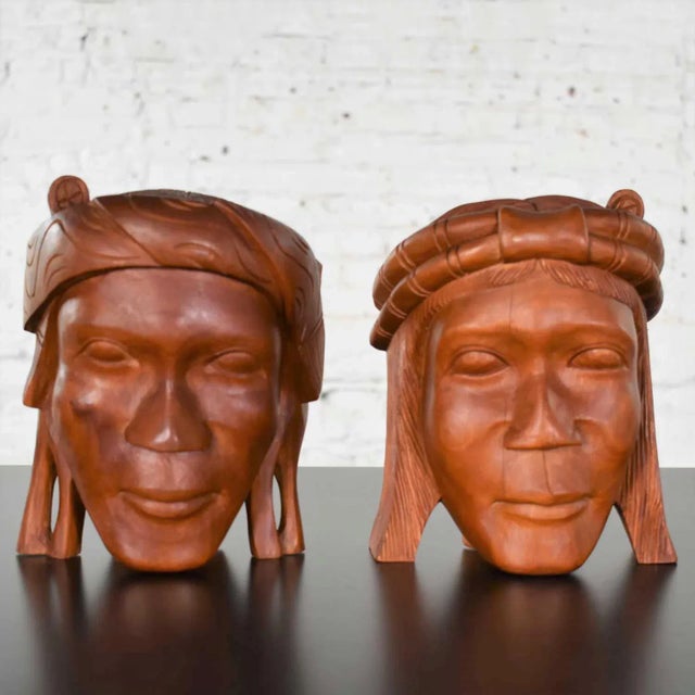 Handsome pair of tribal figural carved wood head bookends. They are in awesome vintage condition. Please see photos. Circa...
