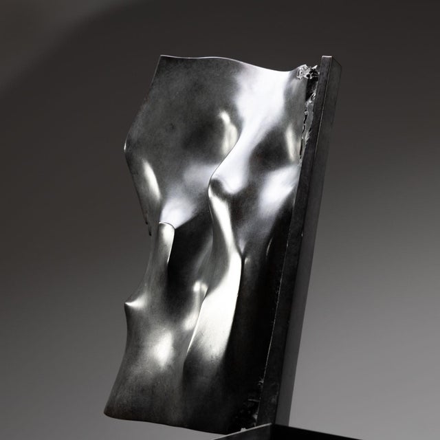 Bronze sculpture ‘Vela’ (eng. sail) by Giò Pomodoro (1930-2002) on a black stone pedestal. Signed and numbered at the...