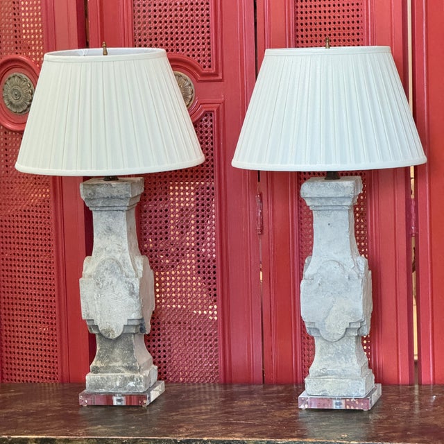 A pair of architectural stone balusters mounted as table lamps — square-cut balusters with shaped panels and a nicely...