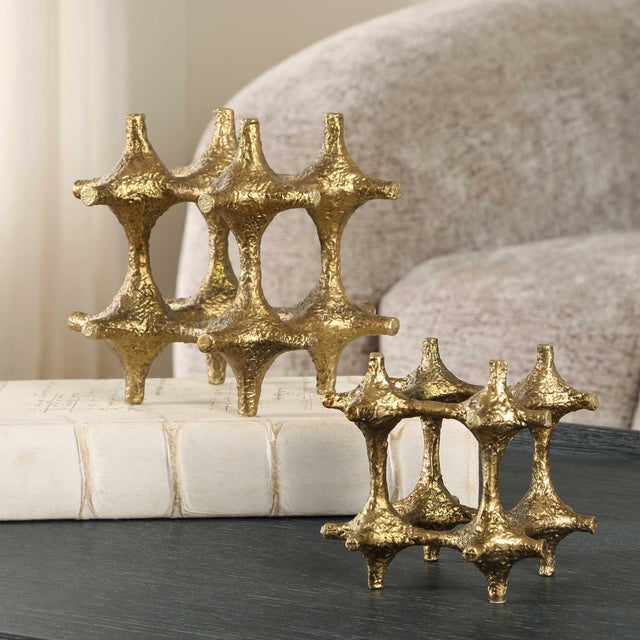 Crafted With An Antique Brass Finish, These Captivating Sculptures Feature Intricate, Multi-pointed Forms That Create A...
