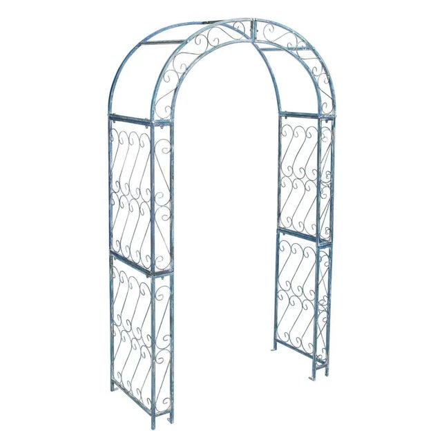 This enchanting outdoor arch conjures images of the entrance to a secret garden, the antique blue trellises scented with...