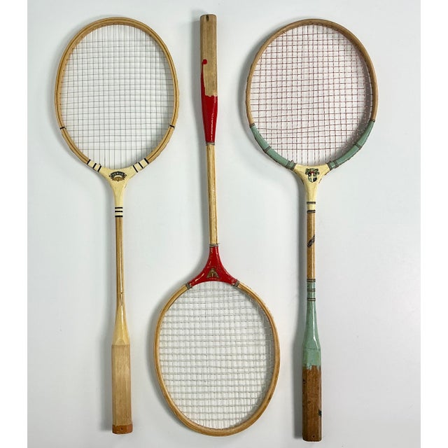 This is a fun vintage decor choice for a game room or cabana. These are a set of 3 of Mid-Century Badminton Rackets. The...