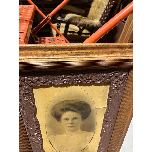 Up for consideration is a beautiful print of a woman in an intricate wooden frame. This would look lovely in your home and...