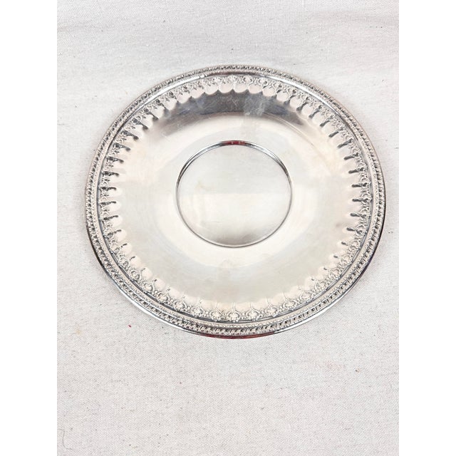 Beautiful vintage Reed and Barton silver plate serving dish. Repousse intricate design on the edge. Beautiful piece that...