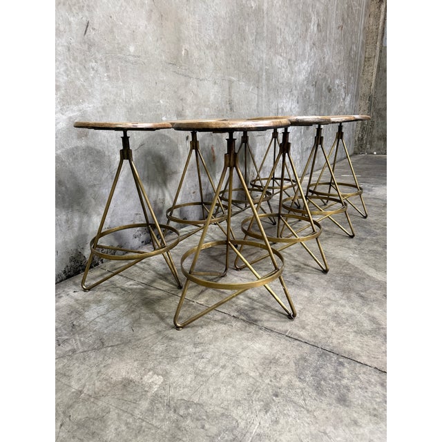 Set of eight Arteriors "Wyndham" swivel counter stools in Natural Wax / Vintage Brass (SKU 6698) — a designer favorite...