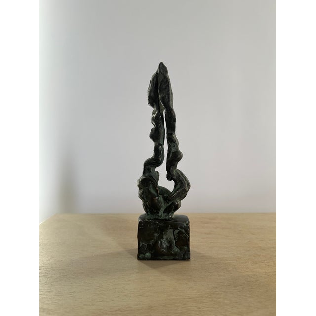 A stylish little abstract sculpture. Bronze - it has a good heavy weight. It tactile surface shows all the marks and...
