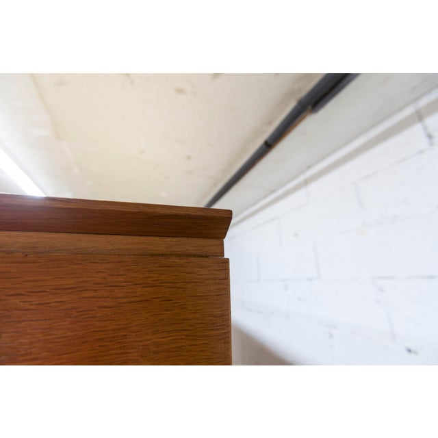 French wardrobe from the 1960s with splayed legs. it consists of a hanging section (2 doors) and a shelving section with 3...