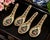 A charming set of four vintage porcelain Chinese soup spoons featuring hand-decorated floral motifs, traditional longevity...