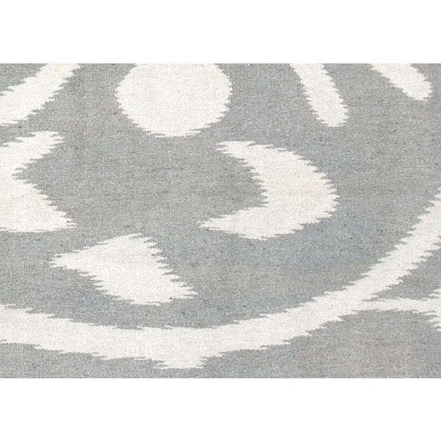 Contemporary Egyptian Kilim in Ikat Design. Hand woven in an Ikat design with wool on cotton foundation in the Fustat...
