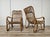 Pair of vintage 1970s wicker and bamboo armchairs. Ideal for decorating an outdoor space, a porch, or an entryway. They...