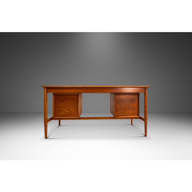 This exquisite Mid-Century Danish Modern writer’s desk, attributed to Arne Vodder for H. Sigh & Son, embodies the refined...