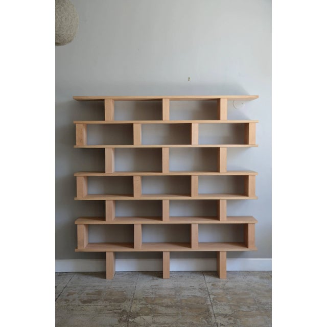 Chic 'Verticale' polished oak shelving unit by Design Frères. Handmade in solid oak, polished and with a clear matte...