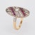 Stylish estate ruby & diamond ring crafted in 18 karat white & yellow gold. Round brilliant cut diamonds total an...