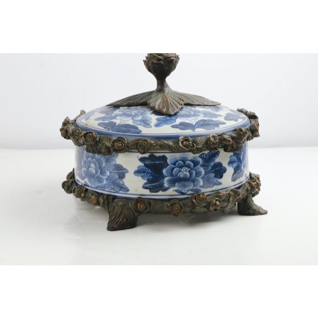 Mid 20th Century Ornate vintage Maitland-Smith decorative box featuring blue-and-white floral porcelain accented with...