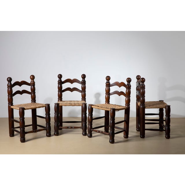 An exceptional and highly charismatic set of four mid-century modern dining chairs, dating to the 1940s/1950s. These...