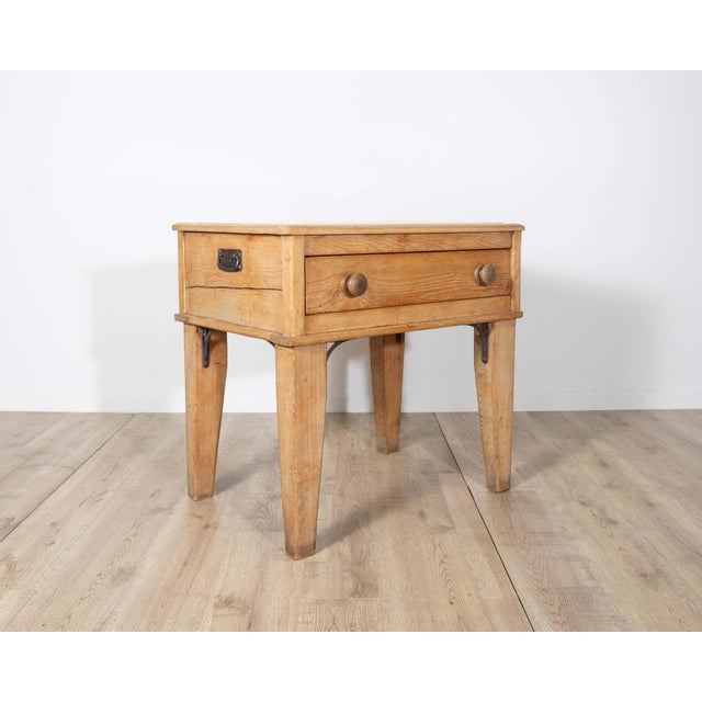 This elegant Louis XVI–style table is crafted in light-toned wood and features refined neoclassical proportions. The piece...