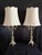 An exquisite pair of French Louis XVI–style four‑arm candelabra lamps, crafted with exceptional detail and refined...