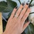 Twenty oval lab grown diamonds totalling 2.66 carats sparkle in a continuous line across this solid 14K white gold band....