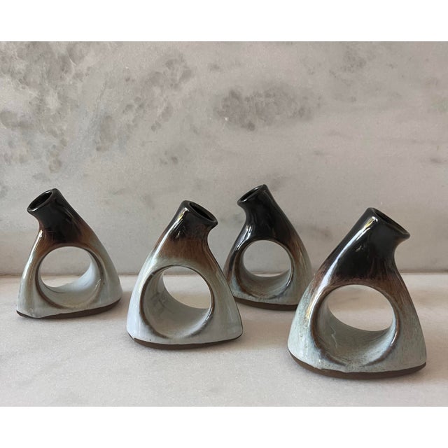 Set of 4 unique vintage napkin ring bud vases made by Peter Pots Studio Pottery. Pieces feature a beautiful light blue...