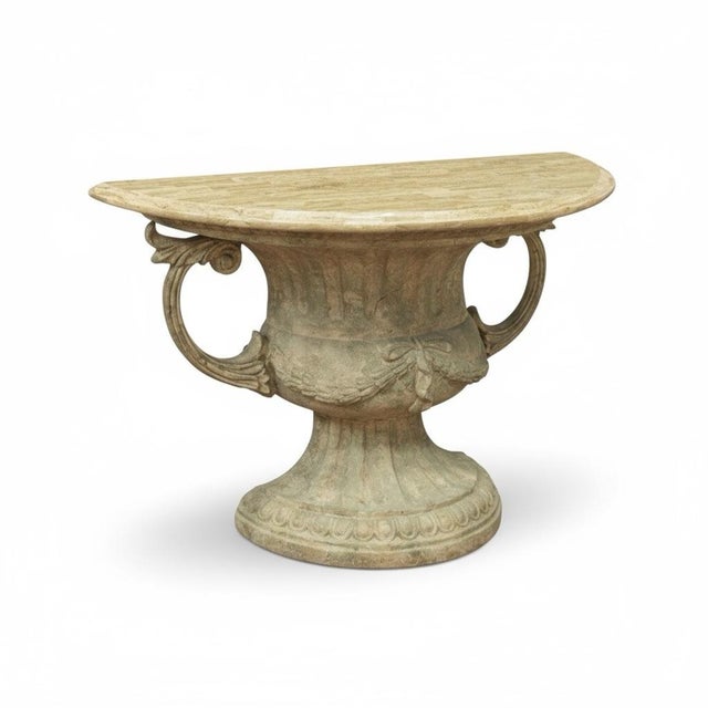 This is a pair of neoclassical style urn form console tables with attached tessellated marble tops. They have intentional...
