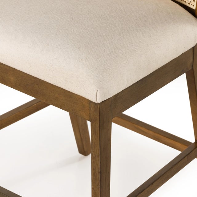 Mixed materials refresh retro stool seating. Light-toasted nettlewood frames a textural inlay of natural cane for a clean,...