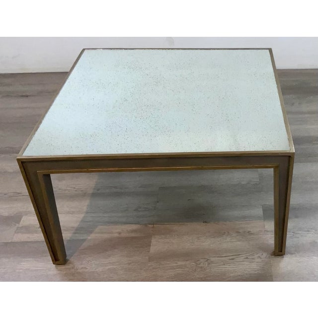 Stylish Antique Mirror Cocktail Table, champagne and gray finished wood frame, showroom floor sample