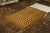 Hand knotted in wool originating from Turkey circa 1950-1960, this vintage rug connotes a mid-century Tulu rug design,...
